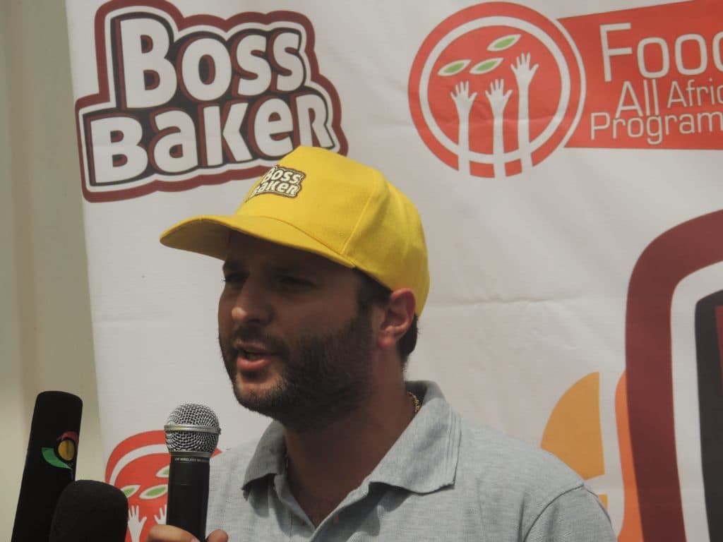 Geoffrey Fadoul speaking at a Boss Baker and Food For All Africa event